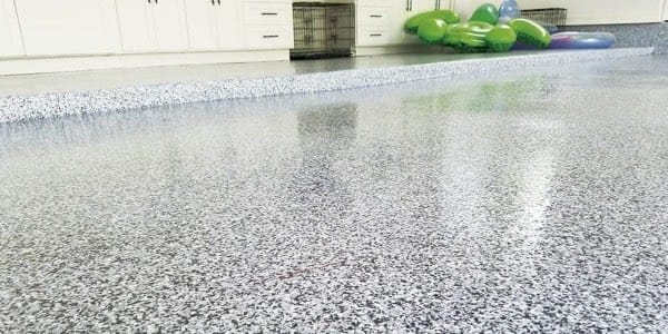 Epoxy flake floor garage installed by Xpedite Coatings.