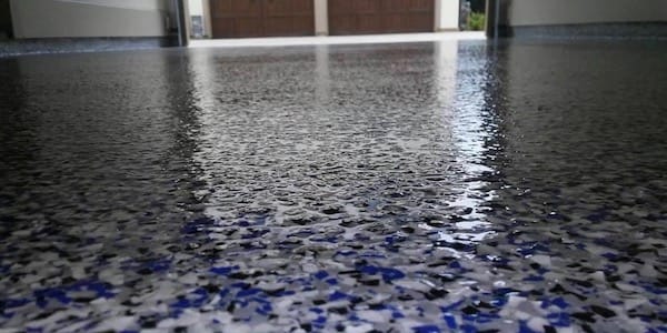 Epoxy garage floor with blue & black flakes.