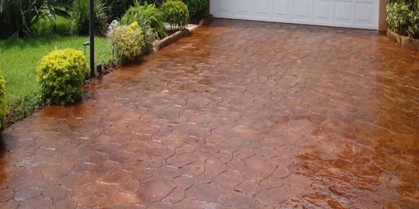 Stamped concrete driveway installed by Xpedite Coatings in Houston, TX.