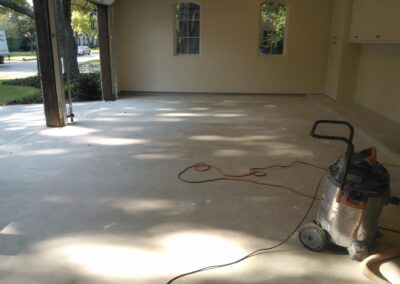 Colored garage floor epoxy sandstone project cleaning.