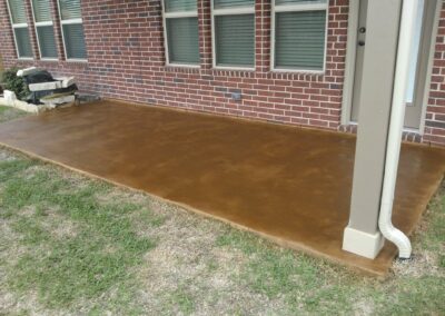 Copper residential stained concrete floors patio view.