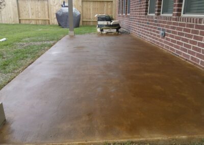 Copper residential stained concrete floors patio closeup.