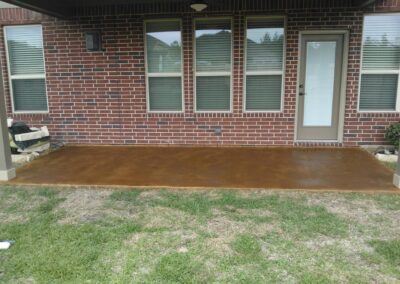 Copper residential stained concrete floors patio backyard.