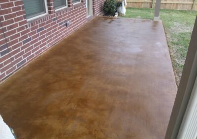 Copper residential stained concrete floors patio.