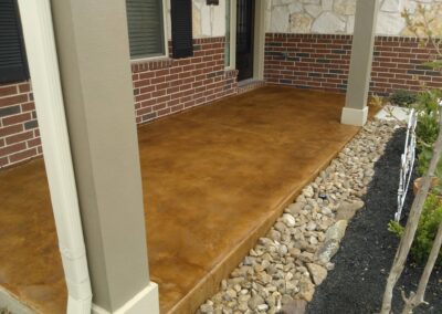 Copper residential stained concrete floors porch view.