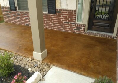 Copper residential stained concrete floors front porch.