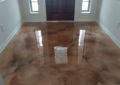 Espresso epoxy flooring metallic foyer.