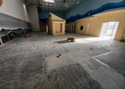 Non-slip concrete coating at Goldfish Swim School building in Houston, TX, by Xpedite Coatings prepare work.