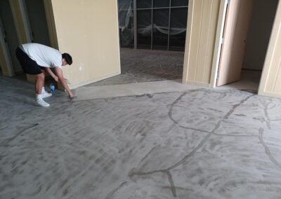 Non-slip concrete coating at Goldfish Swim School building in Houston, TX, by Xpedite Coatings preparing installation.