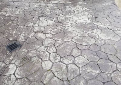 Onyx residential stained concrete before pool area.