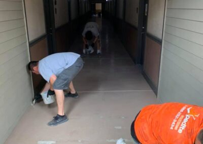 Polyaspartic floor coating walkways project preparing.