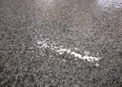 Salt and pepper color quartz commercial garage floor coating.